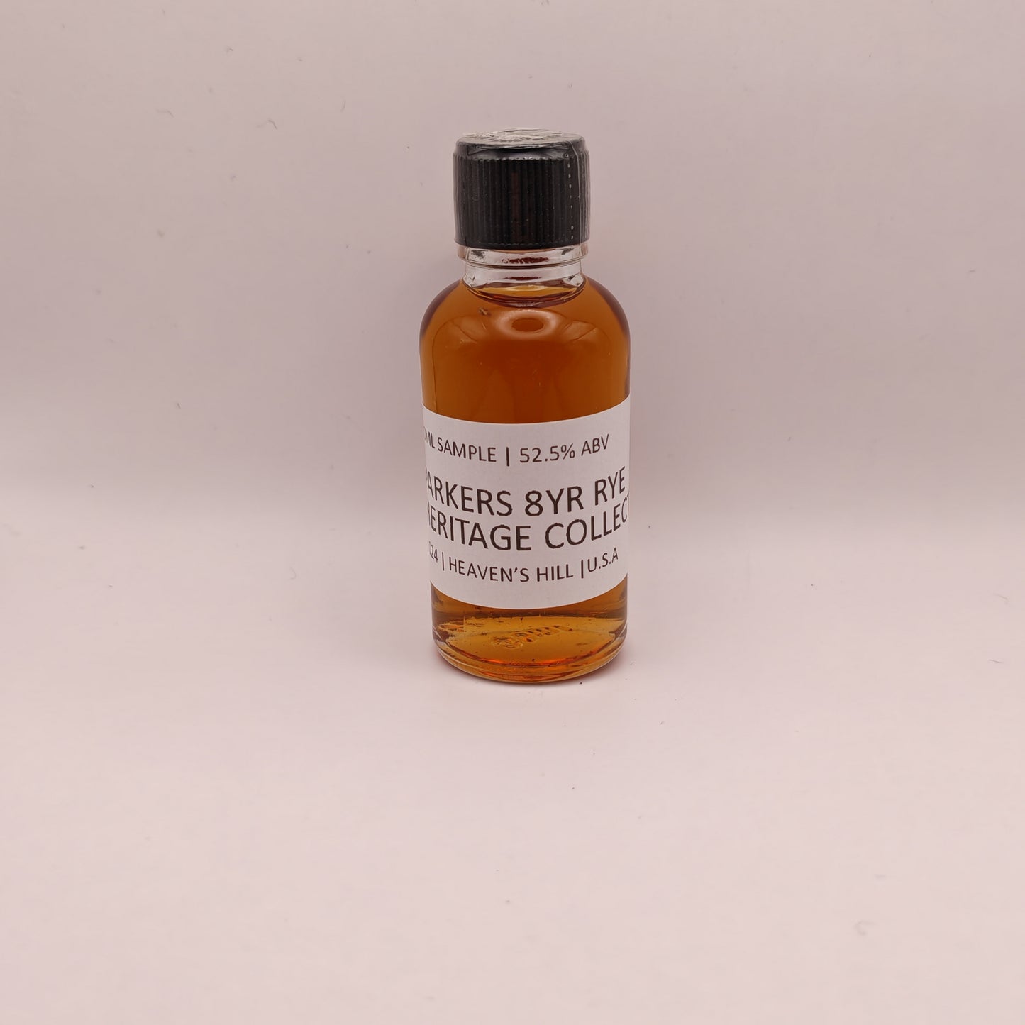 Small bottle of Parkers 8yr Rye Whiskey Heritage Collection on a light gray background