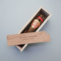 Partagas cigar in a wooden box on a wooden surface