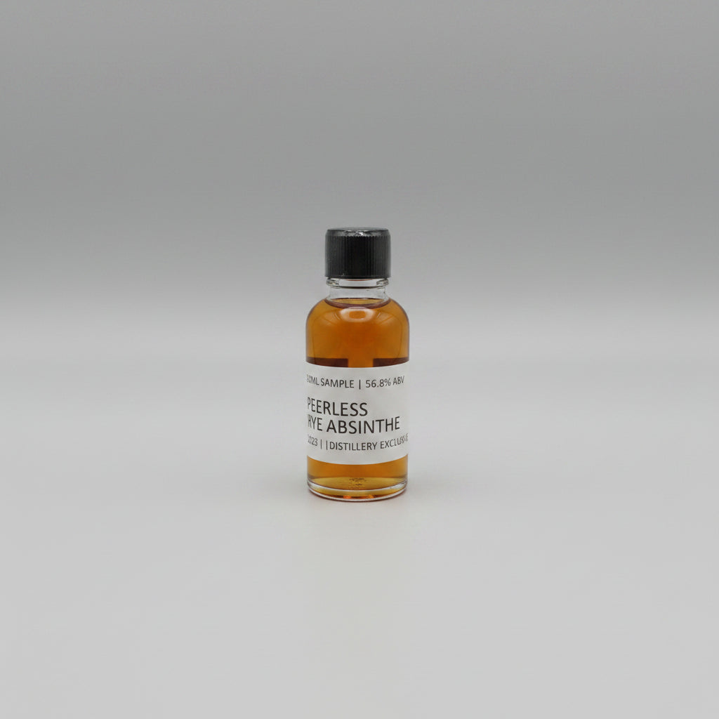 Small bottle of Peerless Rye Absinthe on a white background
