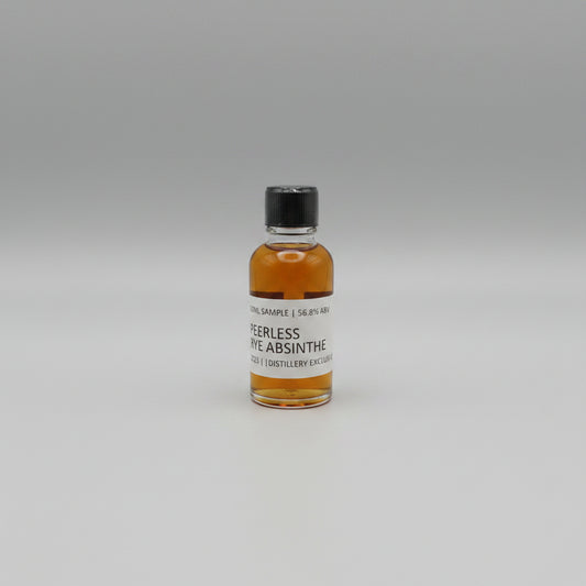 Small bottle of Peerless Rye Absinthe on a white background