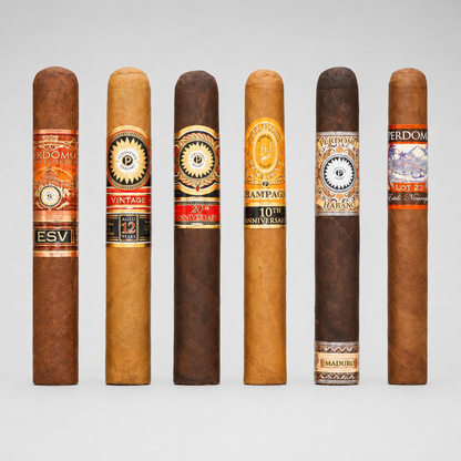 Six cigars in different shades of brown and tan, lined up vertically against a light gray background. Each cigar features a distinct, colorful paper band with text such as 'ESV', 'VINTAGE', '20th Anniversary', 'Champagne', '10th Anniversary', and 'Maduro'.
