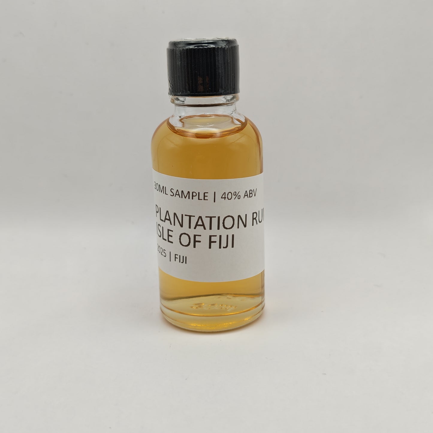 Small bottle of Plantation Rum Isle of Fiji on a gray background