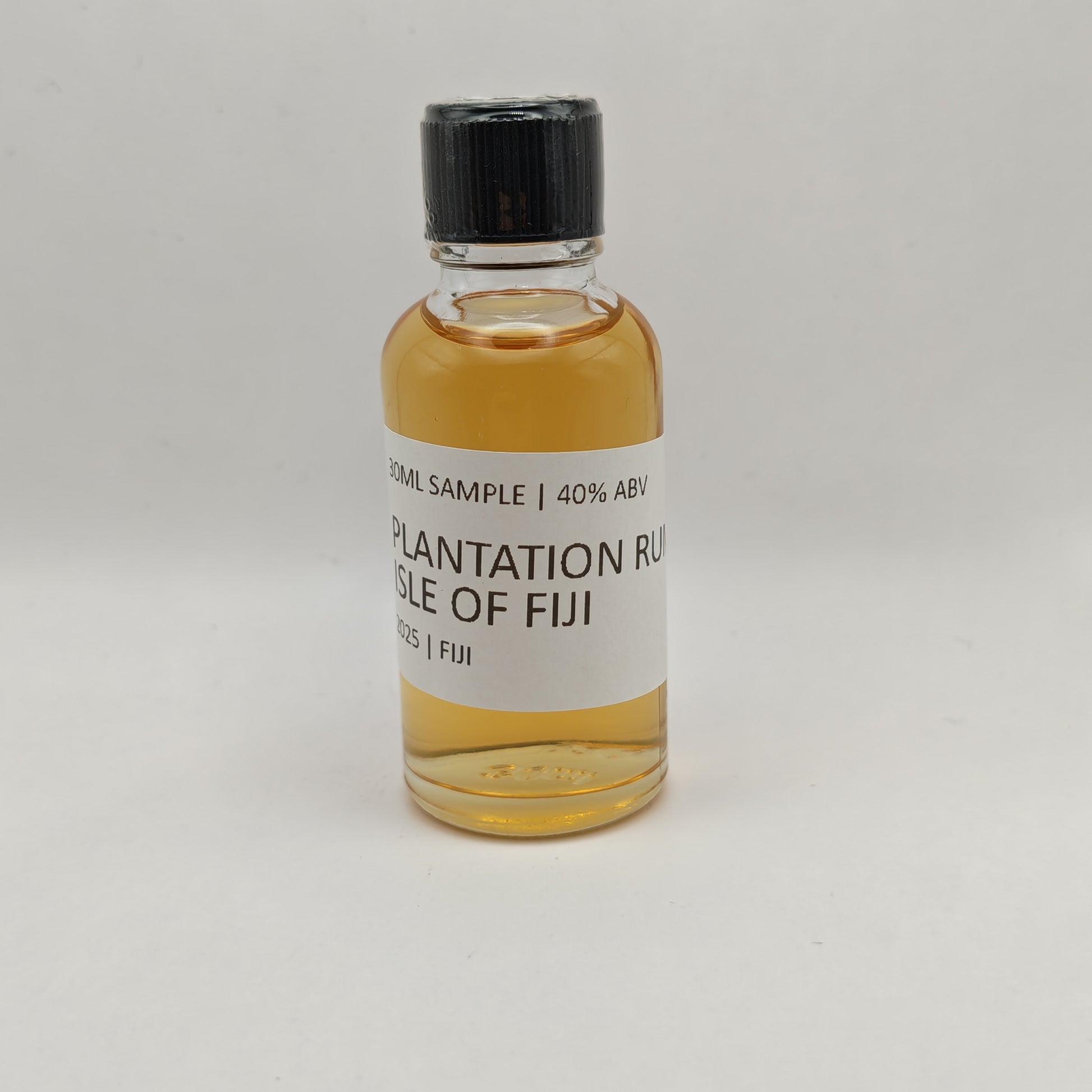 Small bottle of Plantation Rum Isle of Fiji on a gray background