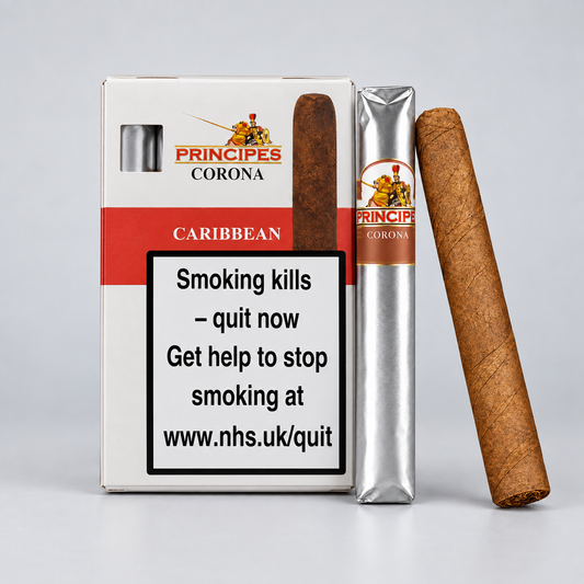 Principes Corona Caribbean cigar packaging and two cigars on a light gray studio background. The box shows the Principes Corona branding and a large smoking-health warning label.