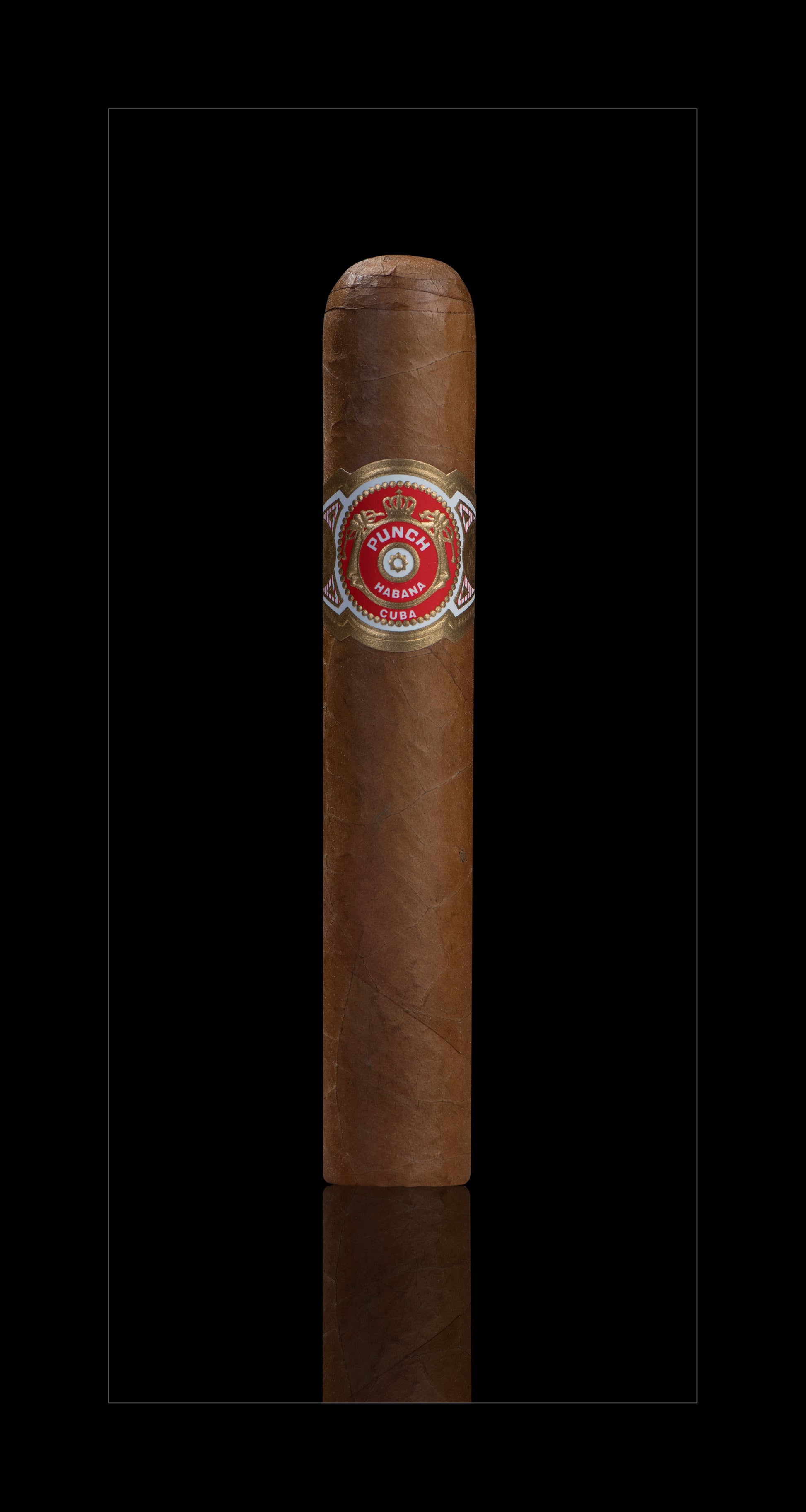 A single brown cigar with a red and gold band, centered on a black background with a subtle reflection below.