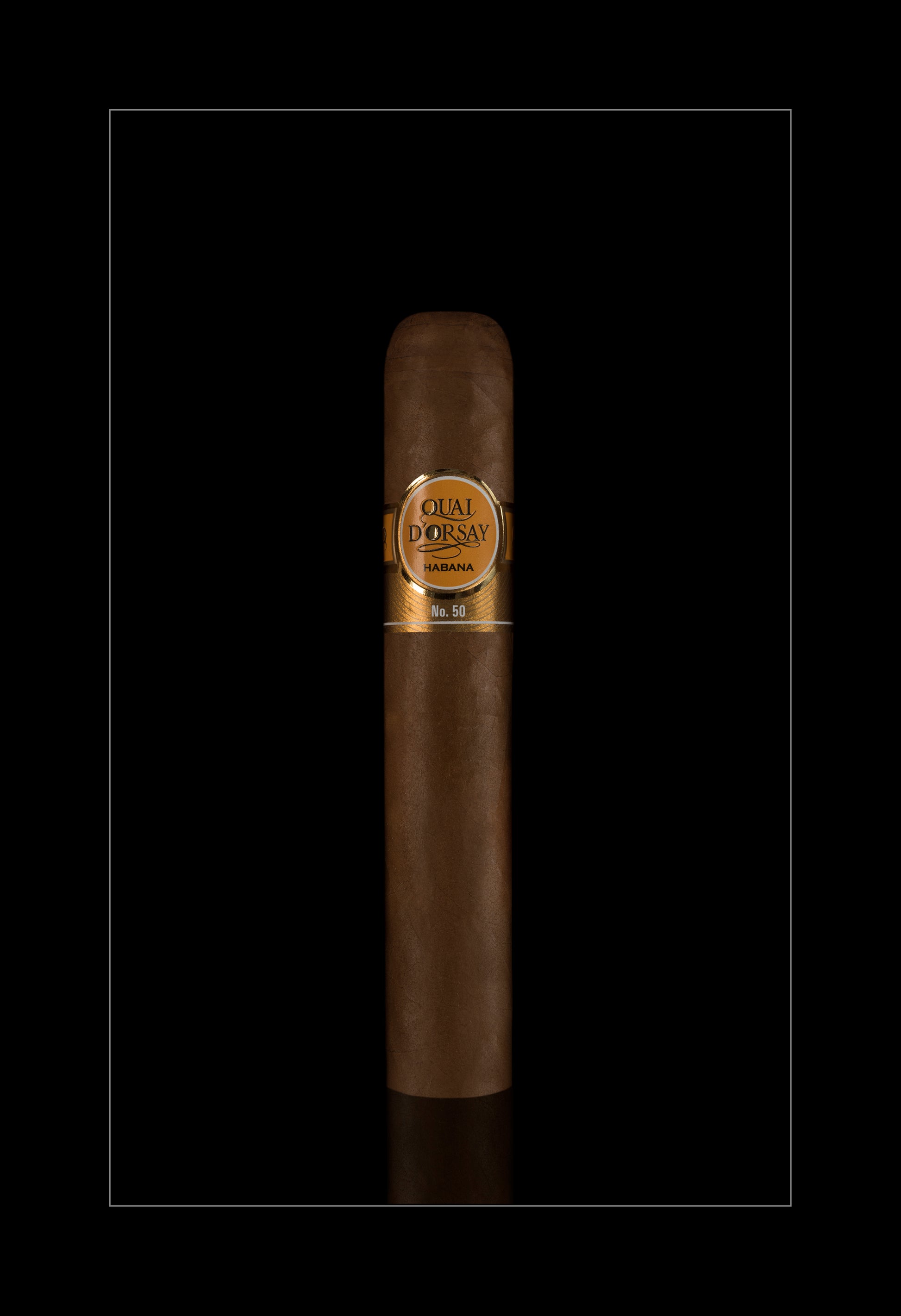 A single dark brown cigar with a gold band reading 'Cual Prossay' and '700 mg' on a solid black background.