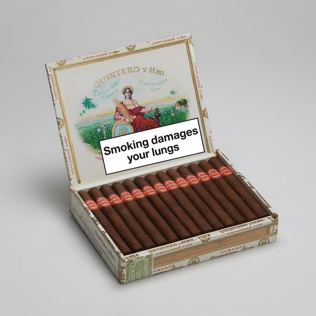 An open box of cigars on a light gray background, with the lid displaying a vintage-style illustration and a prominent white warning label that reads 'Smoking damages your lungs.' The cigars inside are dark brown with red bands, and the box is branded Quintero y Hnos.