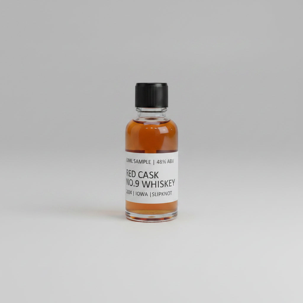Small bottle of RED CASK NO.9 whiskey with a label on a light pink background