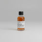 Small bottle of RED CASK NO.9 whiskey with a label on a light pink background