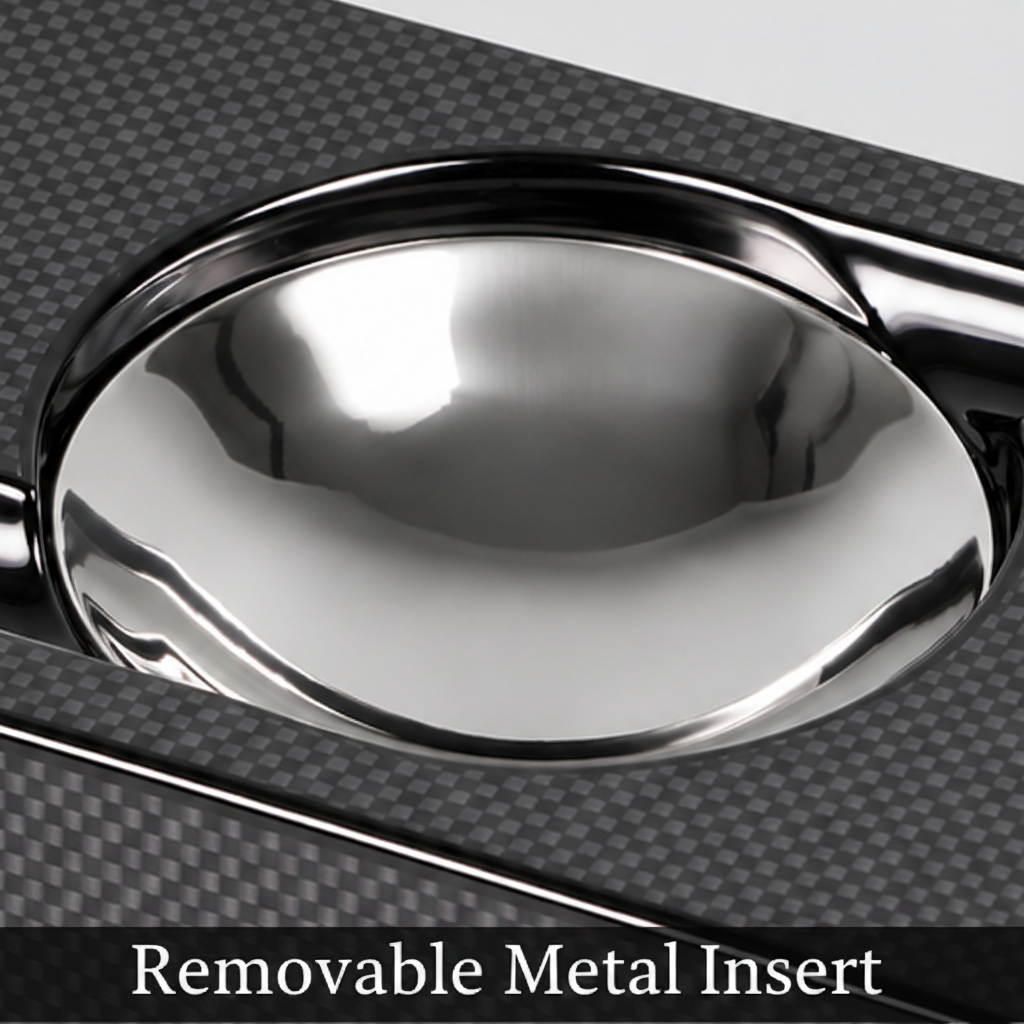 A rectangular black carbon fiber ashtray with a glossy silver metallic bowl in the center, photographed on a light gray background.