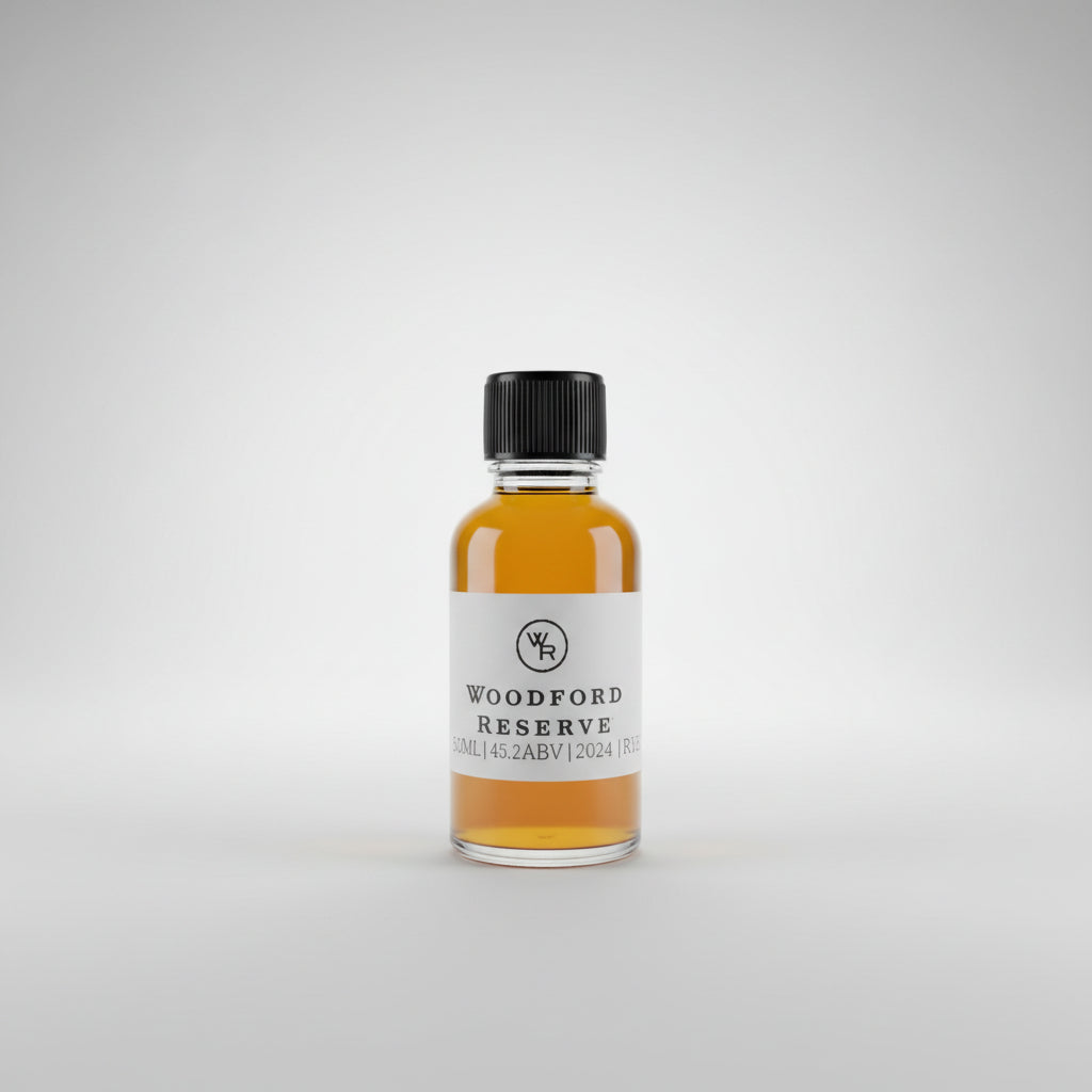 Bottle of Woodford Reserve Rye whiskey on a bar counter with a pool table in the background