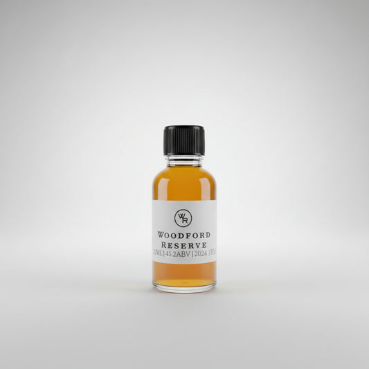 Bottle of Woodford Reserve Rye whiskey on a bar counter with a pool table in the background