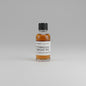 Small bottle of Rittenhouse Straight Rye on a light pink background