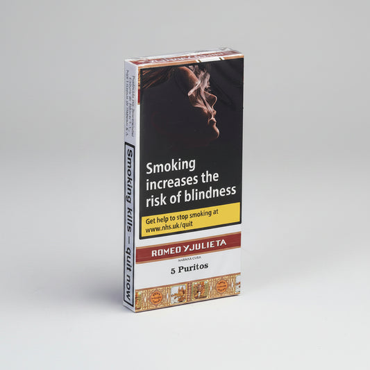 A 5-pack box of Romeo y Julieta Persimona Cura 5 Puritos cigarillos, featuring a prominent smoking warning label on the front with an image of a person smoking and text about blindness.