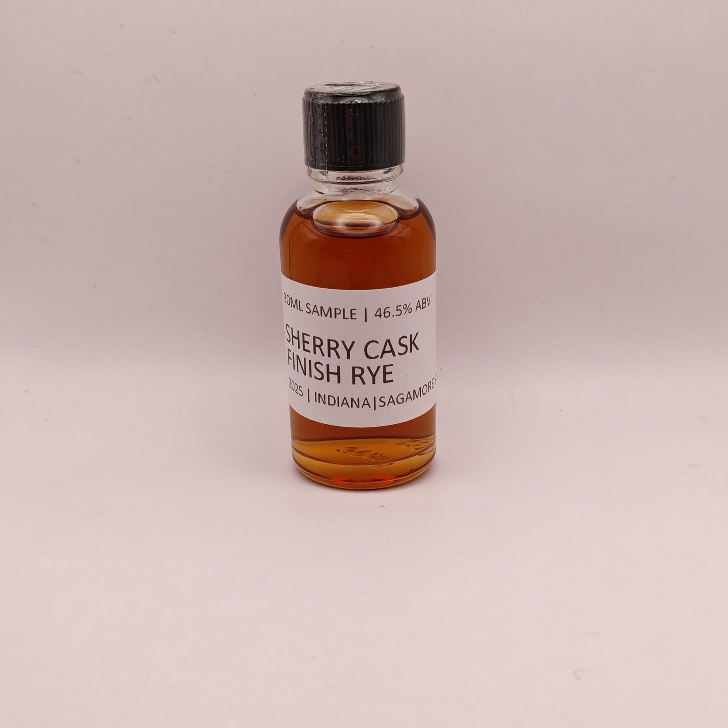 Small bottle of Sherry Cask Finish Rye on a light gray background