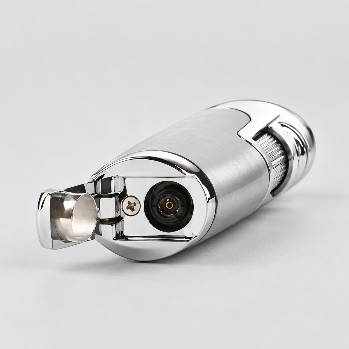 A metallic silver personal torch lighter with a polished chrome finish, shown with the ignition lever open against a light gray background.