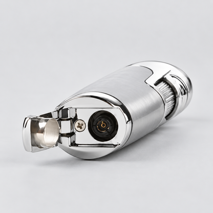 A metallic silver personal torch lighter with a polished chrome finish, shown with the ignition lever open against a light gray background.