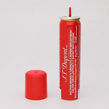 A red can of St. Dunin flameless gas torch lighters with its matching red cap placed beside it on a light gray background.