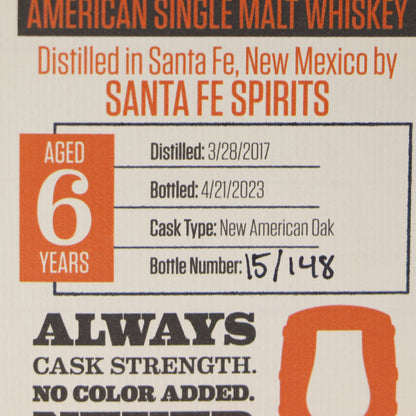 Label of American single malt whiskey from Santa Fe Spirits with aging details and bottle number.