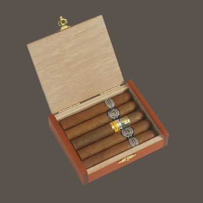 Open wooden cigar box with cigars inside on a white background