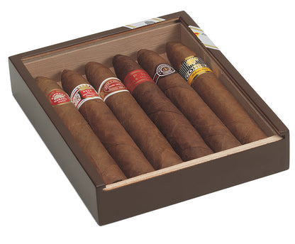 An open dark brown wooden cigar box containing six cigars with various colored bands, photographed on a clean white background.