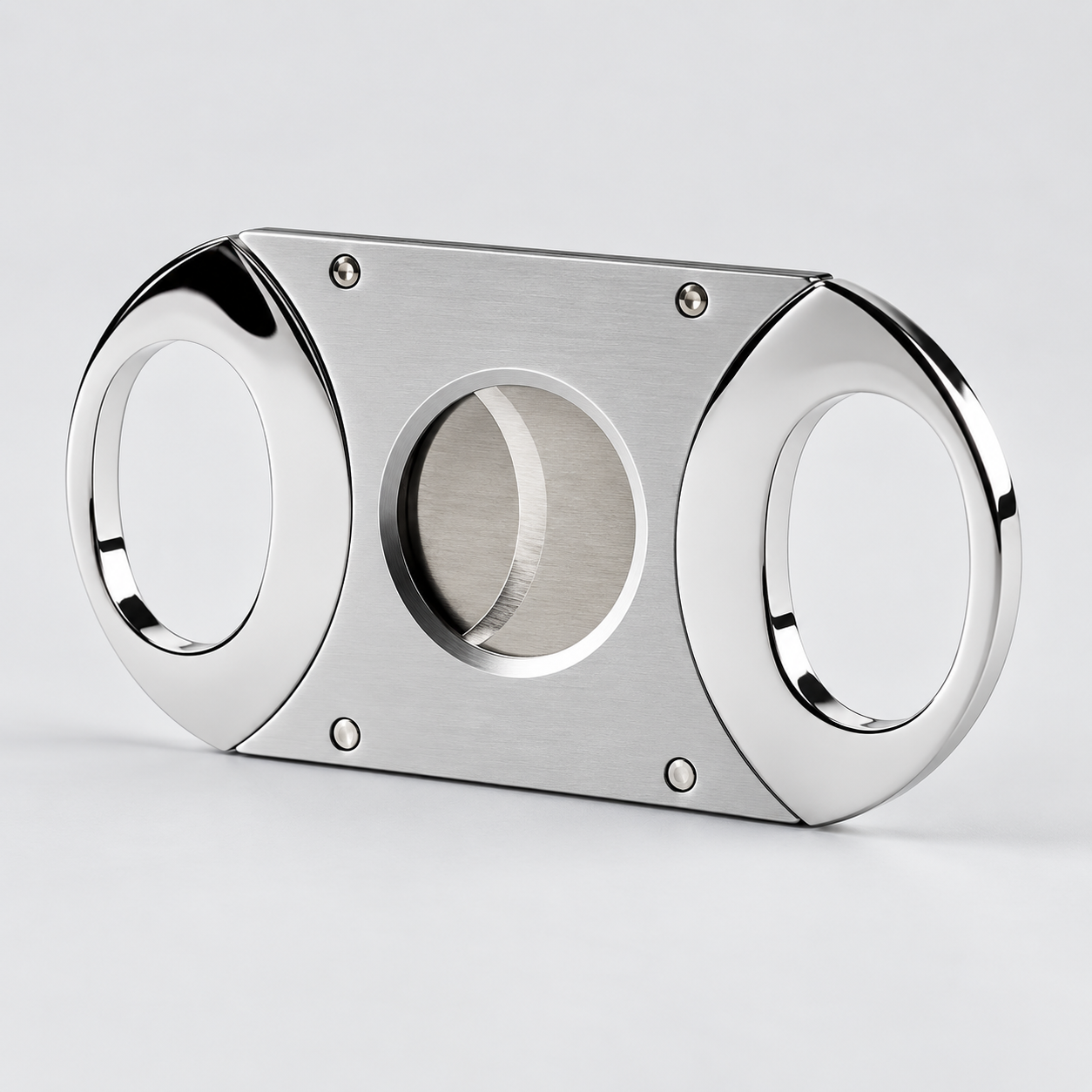 A polished stainless steel cigar cutter with a brushed metal center blade and four visible screws, shown on a clean light gray background.