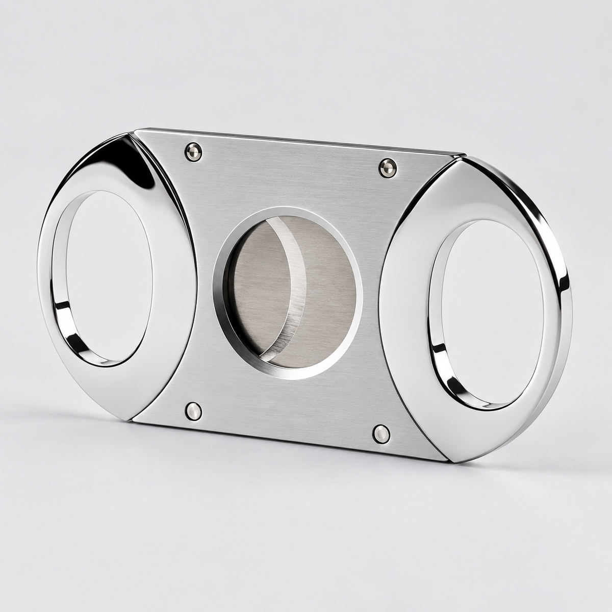 A polished stainless steel cigar cutter with a brushed metal center blade and four visible screws, shown on a clean light gray background.