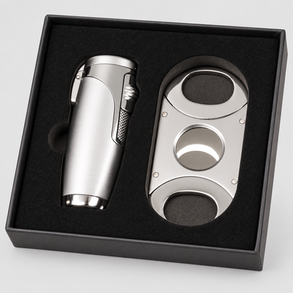 A silver metal cigar set including a lighter and a double-cutting cigar cutter, presented in a black gift box with a black foam insert.