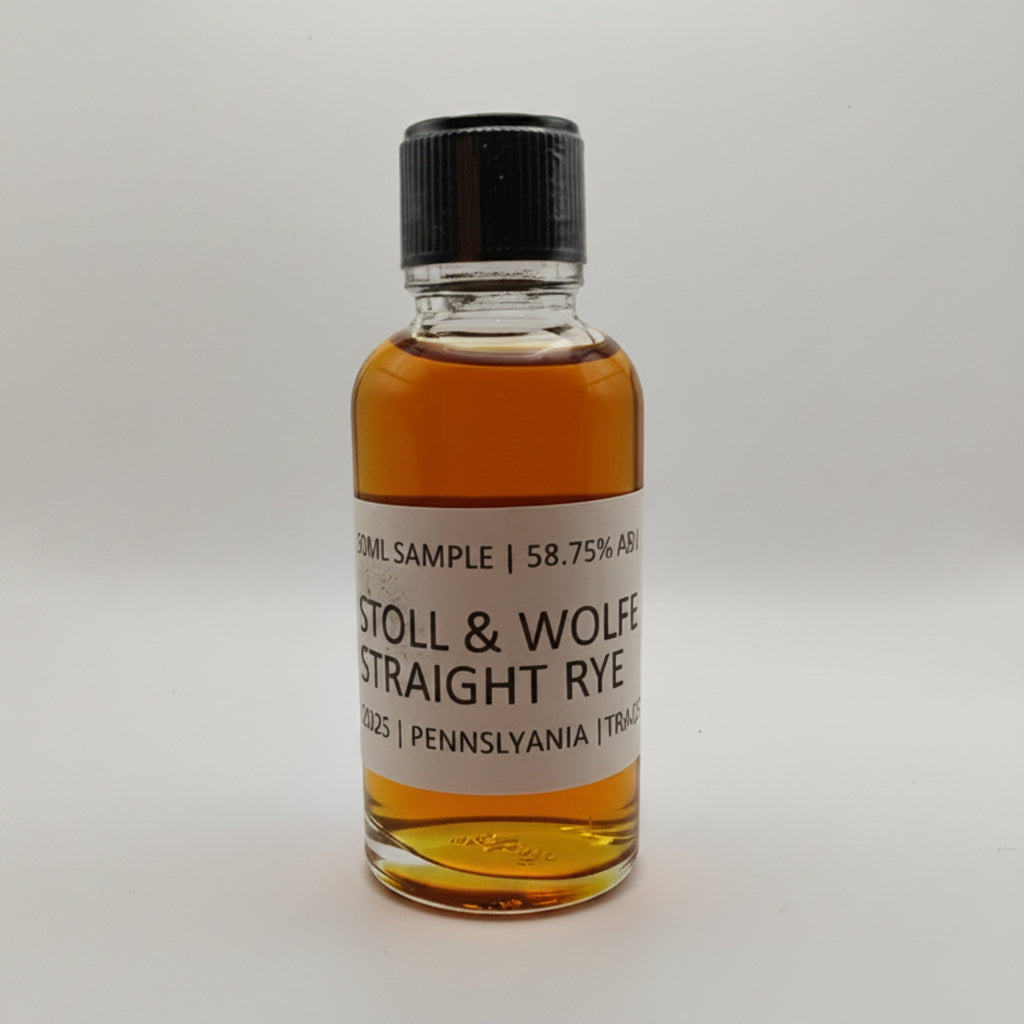 Small bottle of Stoll & Wolf Straight Rye whiskey sample on a white background