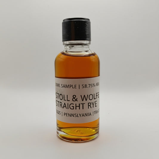 Small bottle of Stoll & Wolf Straight Rye whiskey sample on a white background