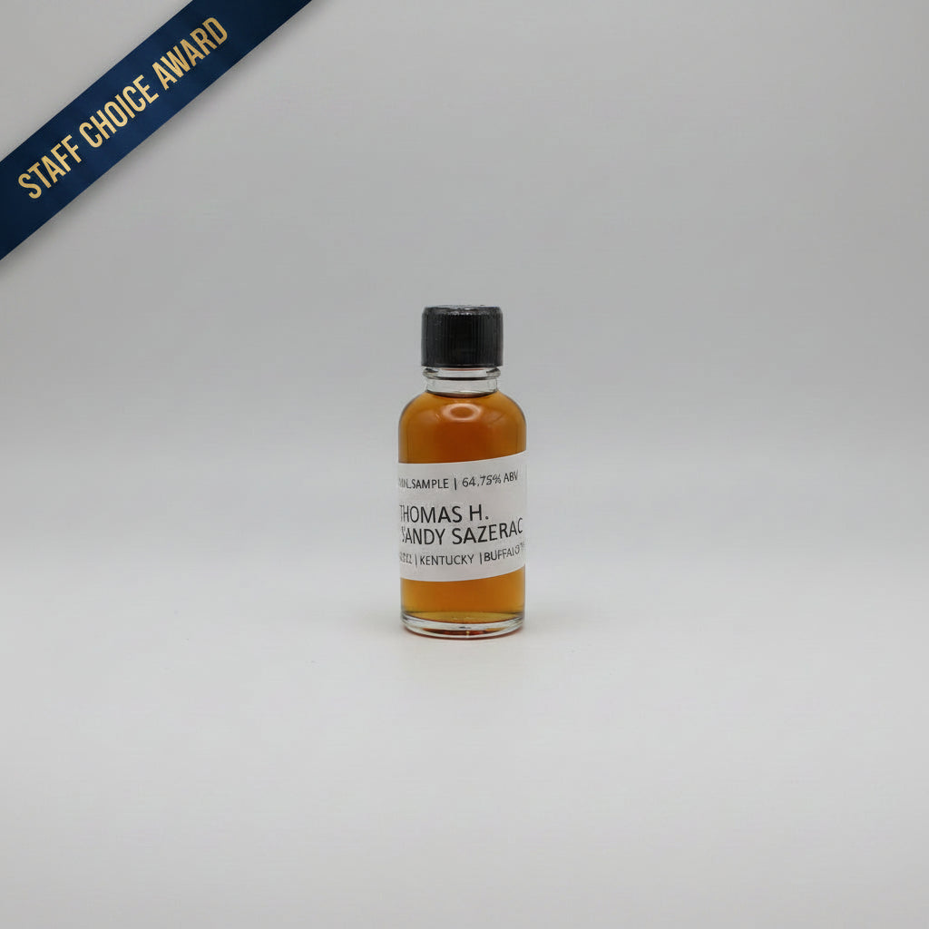 Small bottle of Thomas H. Handy Sazerac whiskey with a black cap on a light white background