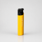 A yellow TORJET portable torch lighter with a black top cap, standing upright on a light gray reflective surface.