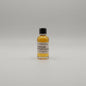 Small bottle of Traveller Whiskey Blend on a light gray background