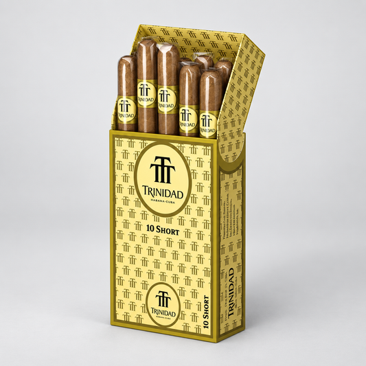 A box of Trinidad cigars, open to show ten cigars inside, set against a clean light gray background. The packaging is gold and white with the Trinidad brand logo.
