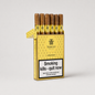 A pack of six Trinidad cigars in a gold and white box with a warning label, photographed on a light gray background.