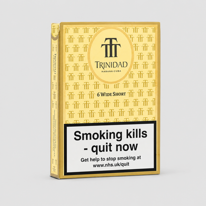 A pack of Trinidad Habanero wide shorts shown at a three-quarter angle on a light gray background. The packaging is primarily gold with a repeating pattern of the Trinidad logo, featuring a large circular gold emblem with the brand name 'TRINIDAD HABANERO CUBES' and a prominent black warning label at the bottom that reads 'Smoking kills - quit now'.