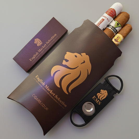 Cigar gift box with cigars, a cigar cutter, and a packet of cigar matches