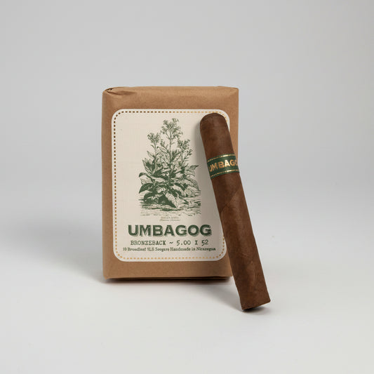 Cigar with 'Umbagog' branding and packaging on a white background
