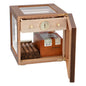 Wooden humidor with glass top and drawer, containing cigars and a box of cigarettes.