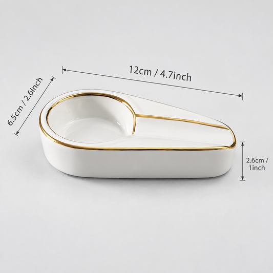 White ceramic double-compartment dish with gold trim, shown on a light gray background with dimension lines and text indicating measurements of 12cm by 6.5cm.