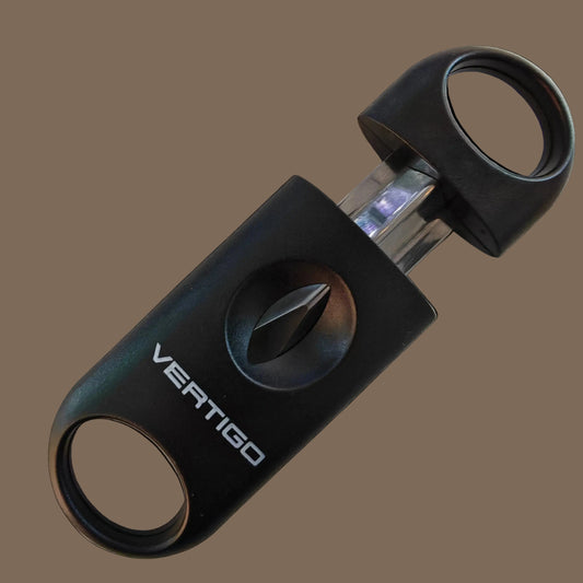 Black Vertigo cigar cutter on a marble surface