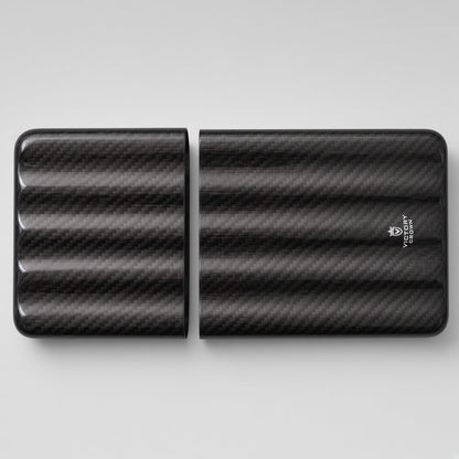 A black carbon fiber patterned portable power bank shown in two halves on a light gray background, with a small white logo on the right half.