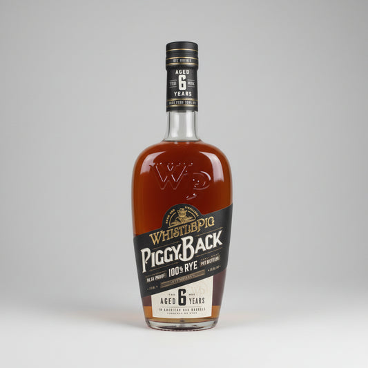 A bottle of Whistlepig Piggy Back 100% Rye Aged 6 Years Scotch whisky, showing the amber liquid inside a clear glass bottle with a black and white label.