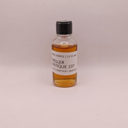 Small bottle of Weller Antique 107 whiskey sample on a light gray background