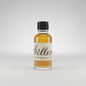 Bottle of Weller whiskey on a bar counter with a blurred background