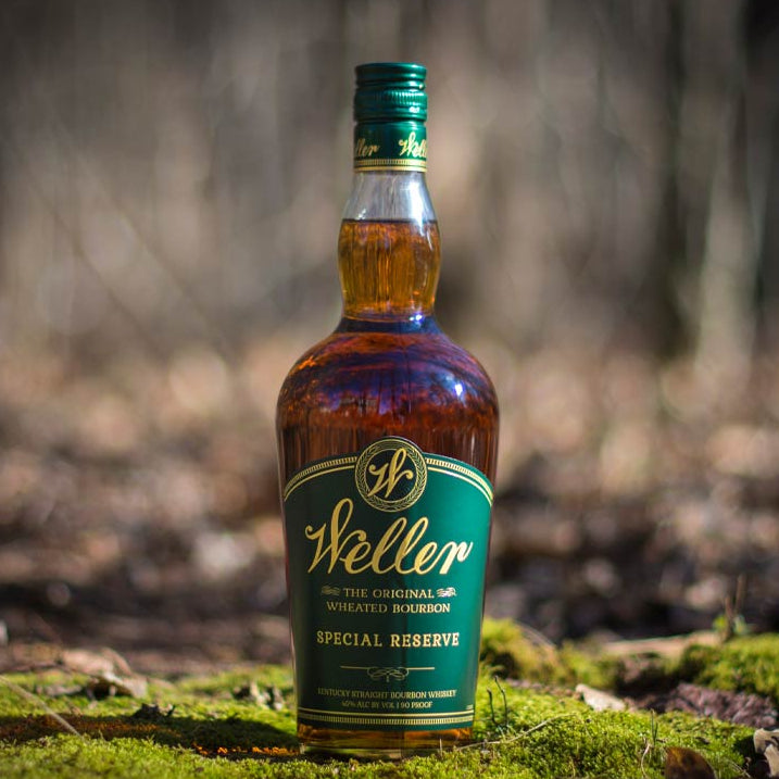 Bottle of Steller Special Reserve whiskey in a forest setting