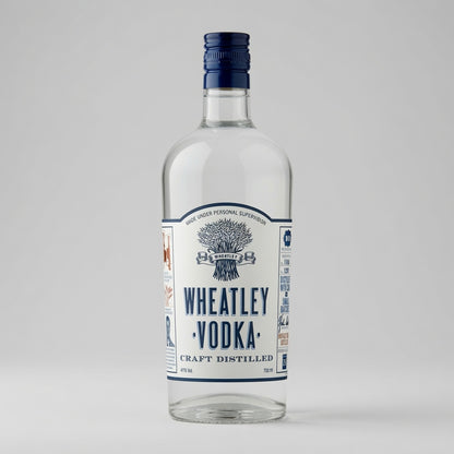 A bottle of Wheatley Vodka Craft Distilled in a clear glass bottle with a white label and dark blue cap, set against a neutral light gray background.
