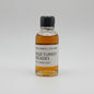 Small bottle of Wild Turkey Decades whiskey on a white background