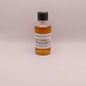 Small bottle of Wild Turkey bourbon on a light gray background