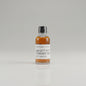 Bottle of Willett Pot Still Straight Bourbon on a reflective surface with blurred background